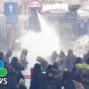 Poland Police Use Water Cannons Against Migrants